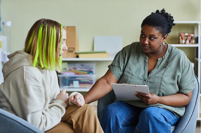 A nurse giving advice to her patient