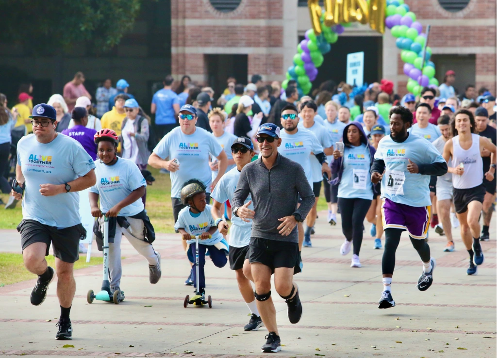 Group of people running outdoors in a community race event